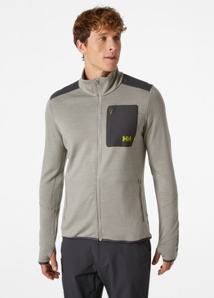 Helly Hansen Merino Wool Midlayer Jacket front view, showcasing the high collar and zippered pockets.
