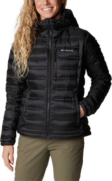 Front view of the Peak Performance women's down jacket, demonstrating its sleek fit and hood design.
