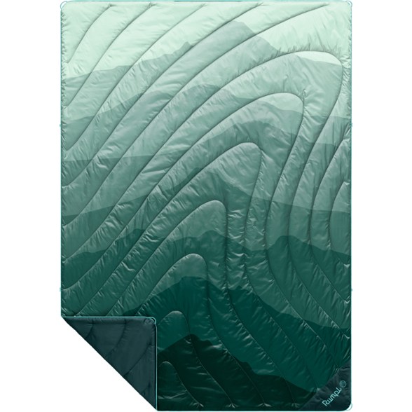 EcoTrail Puffy Camping Blanket spread out on a rocky campsite showing its water-resistant shell