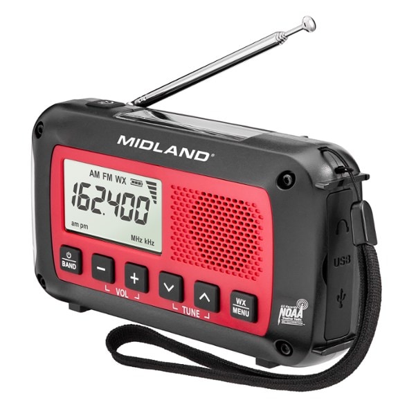 Midland ER40 emergency crank radio with flashlight in a camping setting.