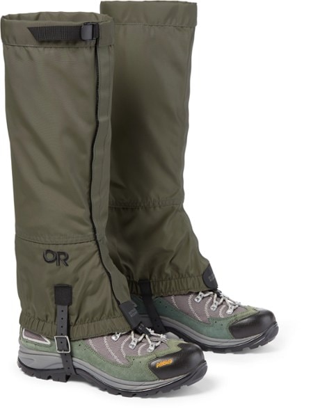 Close-up of TrailGuard gaiters showing reinforced lace hooks and elastic cuff over hiking boots