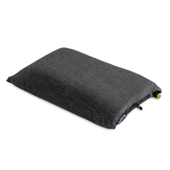 NEMO Fillo pillow showcased in a camping setting, highlighting its compact size and luxury foam.
