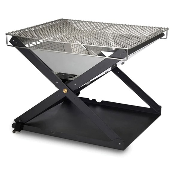 Kamoto Portable Campfire Grill set up at a campsite, surrounded by nature.