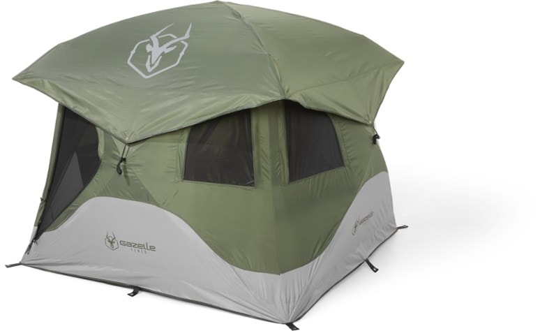 Gazelle T4 Hub tent set up in a lush campsite with family enjoying the outdoors.