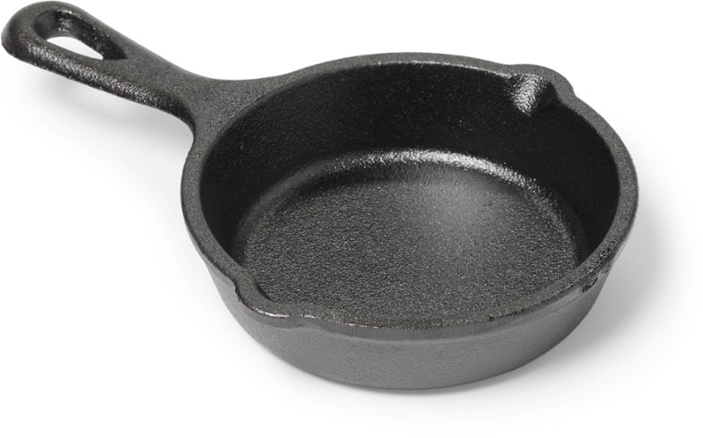 Lodge Mini Cast Iron Skillet showing its 3.5 inch size and seasoned surface.