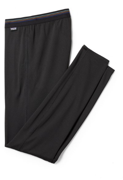 Front view of Patagonia men's thermal base layer bottoms for winter sports.