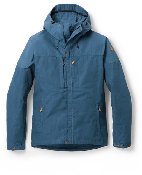 Front view of the men's Fjallraven jacket with adjustable hood and droptail hem on forest trail.