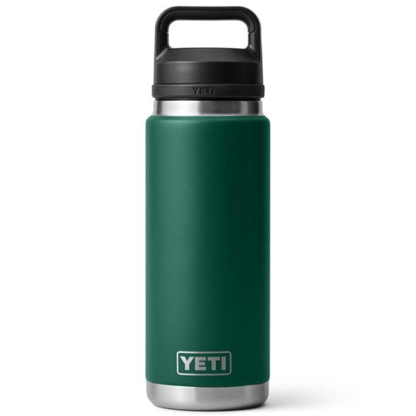 YETI Rambler vacuum bottle with Chug cap showing the triple haul handle in a hiking setting.