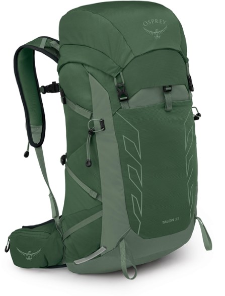 Osprey Talon 33 men's lightweight hiking backpack from the side, showcasing its top-loader design.