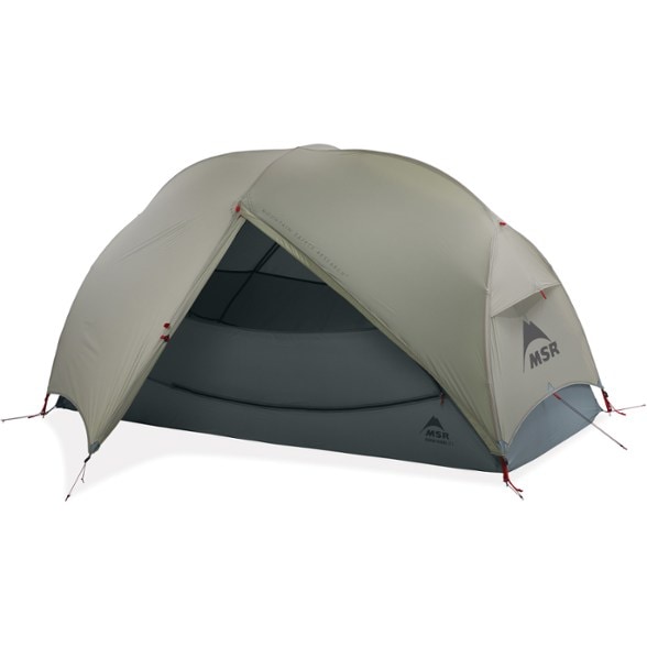 MSR Hubba Hubba LT tent setup in a forest setting showcasing its spacious interior and rainfly.