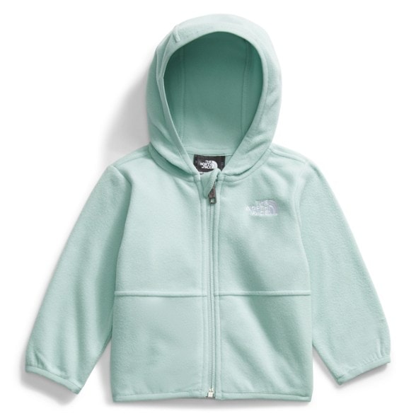 Infant wearing eco-friendly recycled fleece hoodie outdoors during winter.