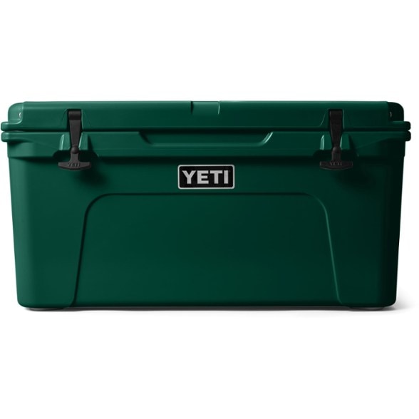 YETI Tundra 65 cooler on a picnic table with food and drinks.