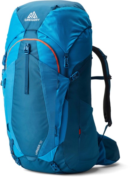 A side view of the kids hiking backpack packed for a weekend hike, showing mesh compartments and hydration hose routing.