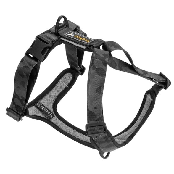 Side view of the adjustable dog harness showing aluminum D-rings and reflective piping.
