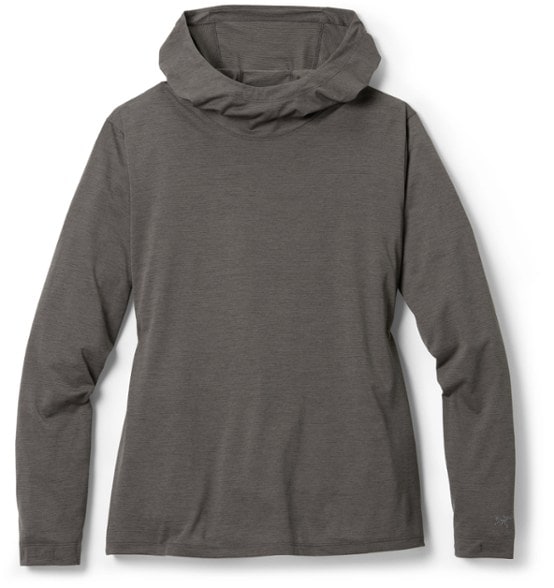 Front view of women's hoody worn during a sunlit hiking trail, highlighting hood fit and sleeve coverage