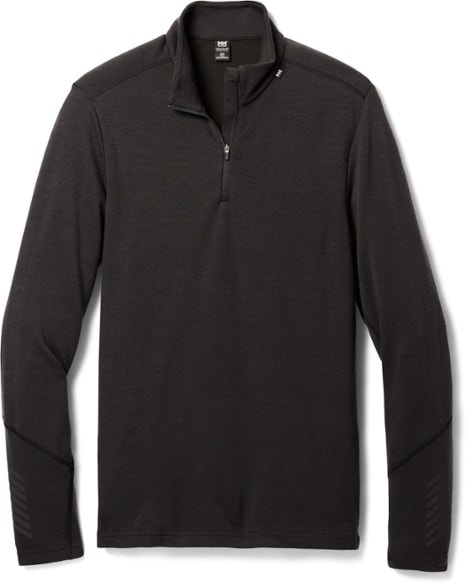 Men's Lifa Merino Half-Zip Top in action during skiing, highlighting its warmth and comfort.