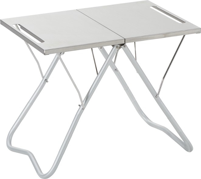 Stainless steel camping table set up for a picnic, highlighting its collapsible feature.
