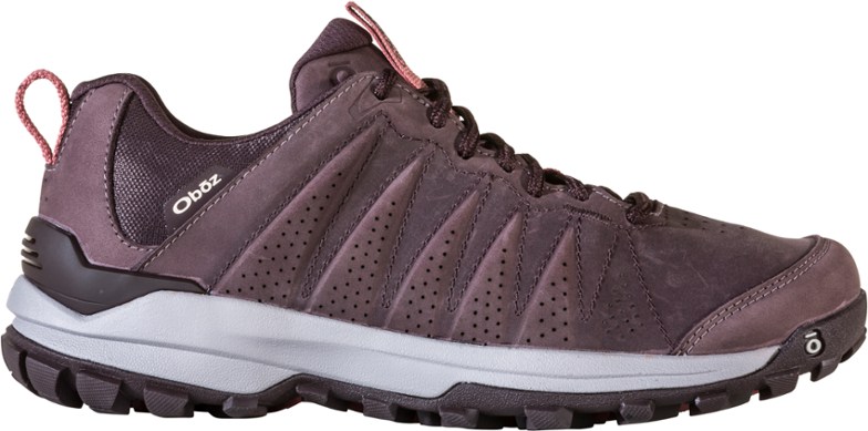 Sypes Women's Low-Profile Waterproof Hiking Shoes on rocky terrain, highlighting their grip and support.