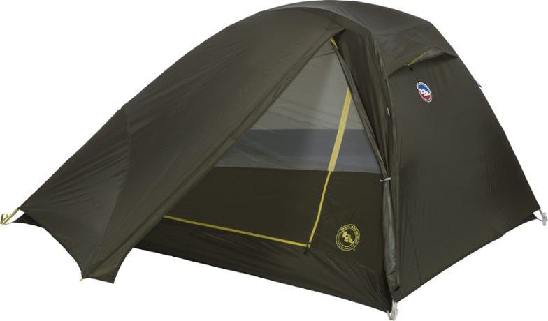 Big Agnes Crag Lake 3 tent with open doors on a campsite surrounded by trees.