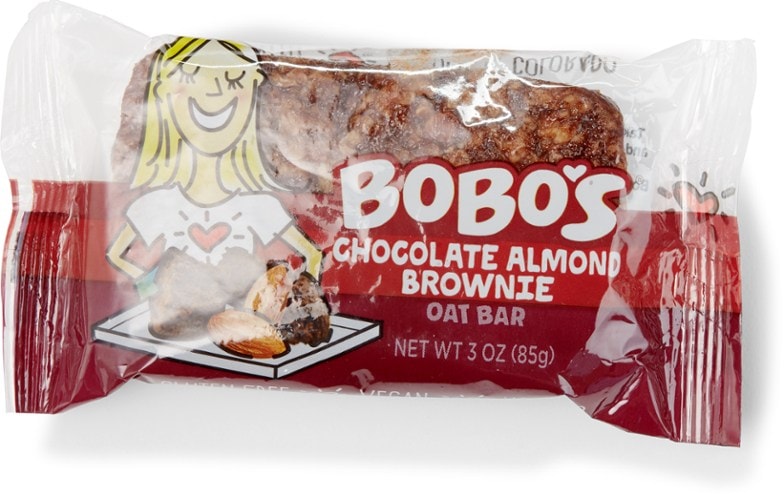 Close-up of chocolate almond oat bar sliced to show chewy texture and chocolate chips