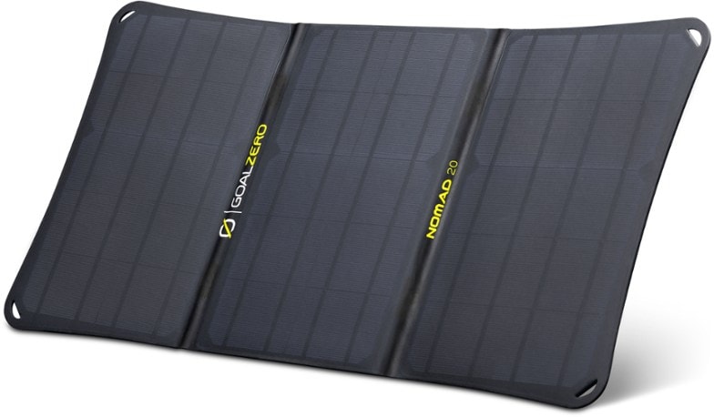 Nomad 20 solar panel set up in the sun, charging a smartphone.