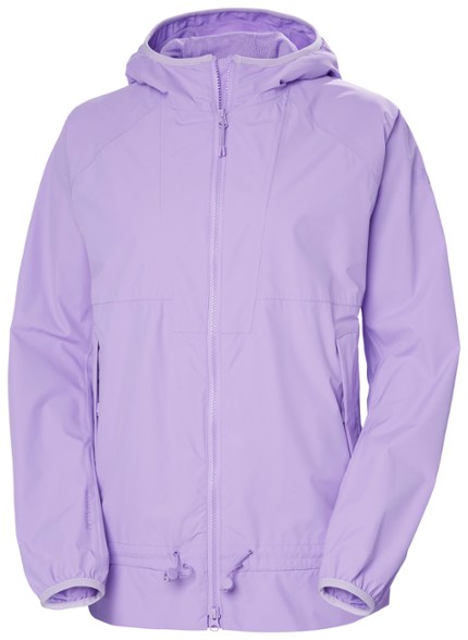 Helly Hansen Women's Essence Rain Jacket in a vibrant outdoor setting, showcasing its sleek design and waterproof features.