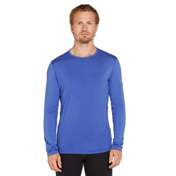 Front view of men's merino wool base layer shirt displayed flat with gusseted underarms visible