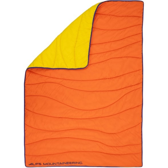 Wavelength Insulated Camping Blanket folded neatly in a stuff sack, perfect for travel.
