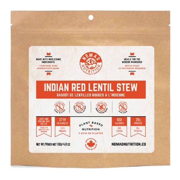 A steaming bowl of Nomad Nutrition Vegan Indian Red Lentil Stew, showcasing vibrant colors and textures.