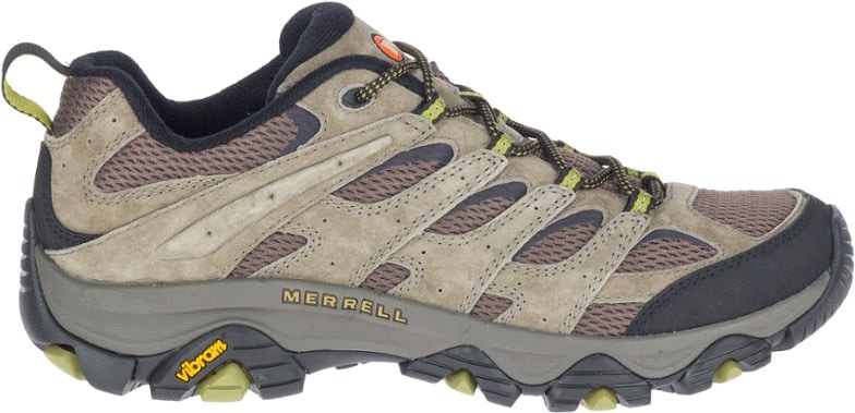Merrell Moab 3 hiking shoes in action on a rocky trail, showcasing their grip and support.