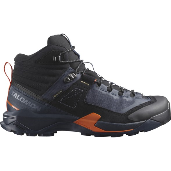 Side view of men's alpine footwear with rugged tread and ankle support, ideal for mountain trails