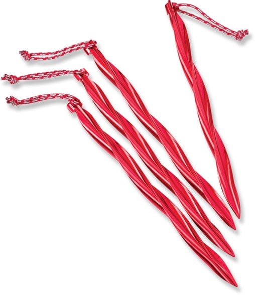 Close-up of CyclonePro spiral tent stakes showing durable aluminum and reflective pull loop in camping gear setup