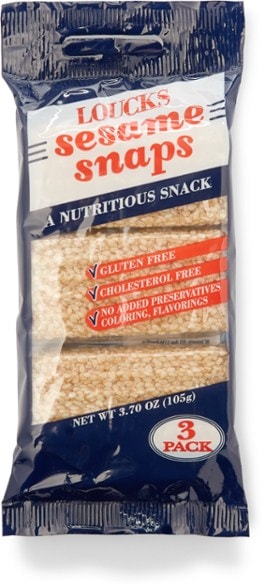 Nutty sesame snack packs displayed outdoors, perfect for hiking.