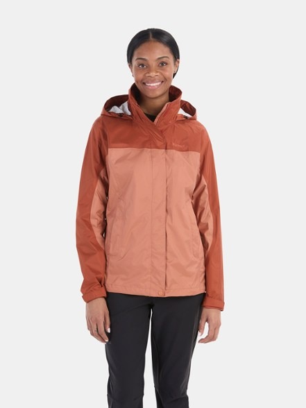 Close-up view of the eco-friendly women's lightweight rain jacket showcasing pit zippers and adjustable hood.