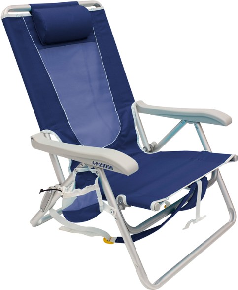 Adjustable backpack beach chair set up on the beach with a cooler