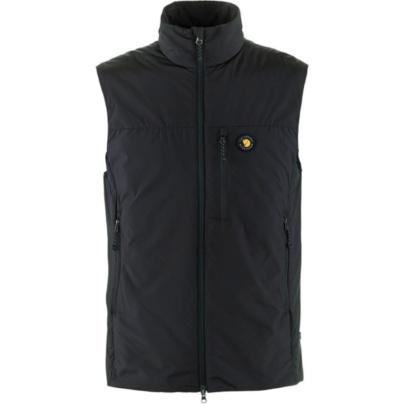 Bergtagen Men's PrimaLoft Insulation Vest in action on a snowy mountain trail.