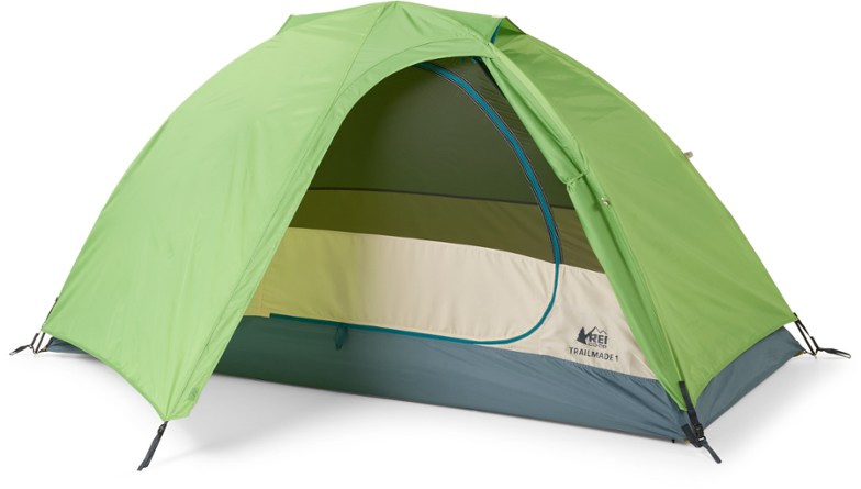 Front view of the Trailmade Solo Backpacking Tent set up in a forest, highlighting its freestanding design.