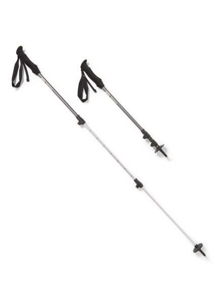 Trailmade trekking poles resting on rocky terrain, perfect for hiking stability.