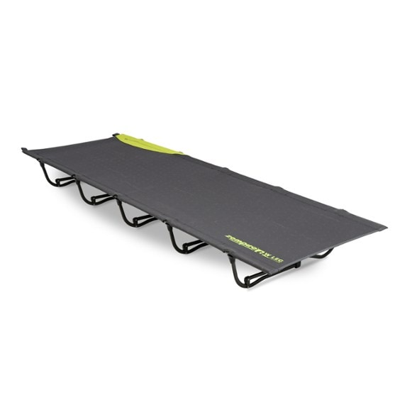 Side view of TrailMaster UltraLite folding camping cot set up outdoors, showing heavy duty durable surface and steel frame