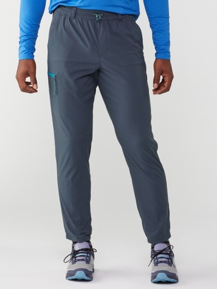TrailBlaze men's joggers in action during a hiking trip, showcasing their water-resistant features.