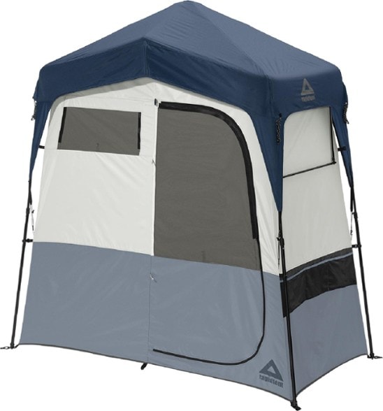 Caddis Quick-Setup Camping Privacy Shelter set up in a campsite, showcasing the attached changing room.