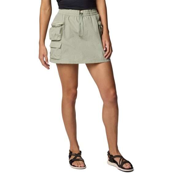 Elevated Adventure Women's Cargo Skort displayed in a sunny outdoor setting, emphasizing its lightweight feel and practical pockets.