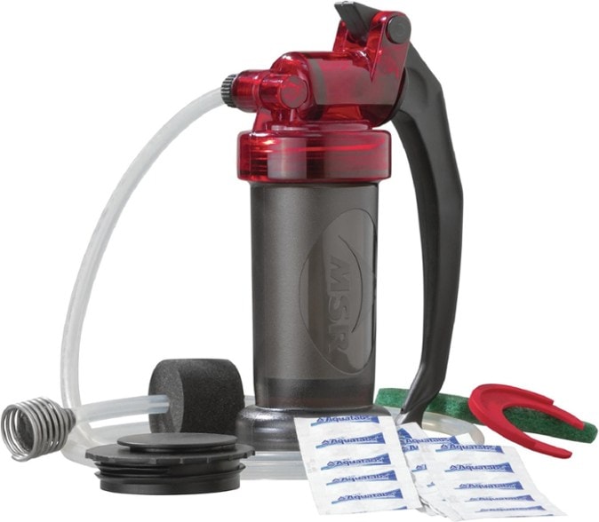 MSR MiniWorks EX water purifier set up by a campsite, demonstrating its compact design and efficiency.