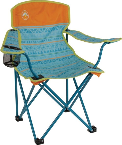 Coleman kids camping chair with cup holder, glowing in the dark, set up at a campsite.