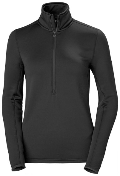 Odin Power Stretch Thermal Half-Zip Top for Women in action during skiing, showcasing its warmth and flexibility.