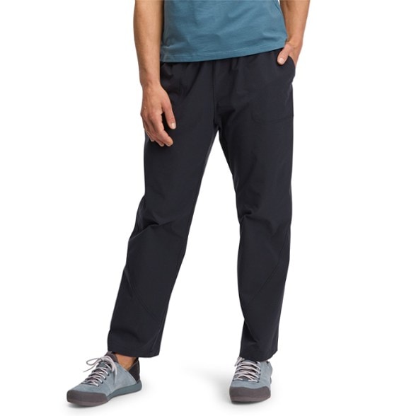 Elevate Women's Climbing Pants in action on a rock face, showcasing their flexible fit.