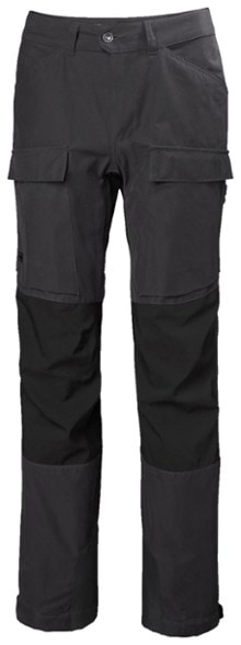 Helly Hansen Women's Veir Tur Trail Pants showcased on a hiking trail, demonstrating side ventilation zippers and reinforced knees.