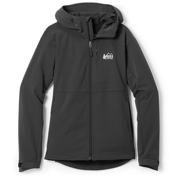 Side view of woman wearing soft-shell hoodie on a mountain trail during sunrise