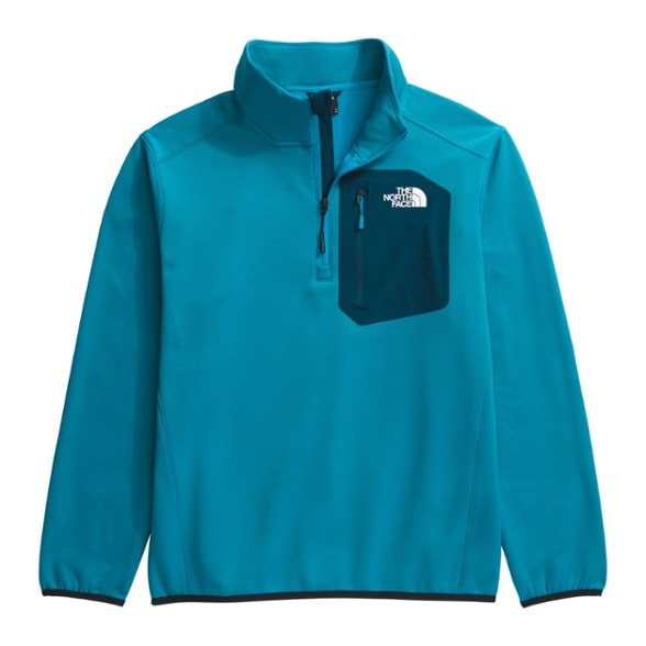 Men's quarter-zip fleece pullover showcasing the brushed back fabric in a natural landscape.