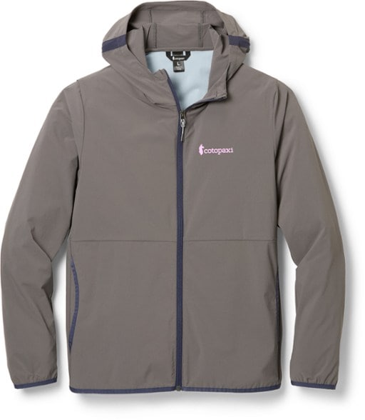 Vuelta Women's Lightweight Windbreaker showing back and shoulder vents on a hiking trail.